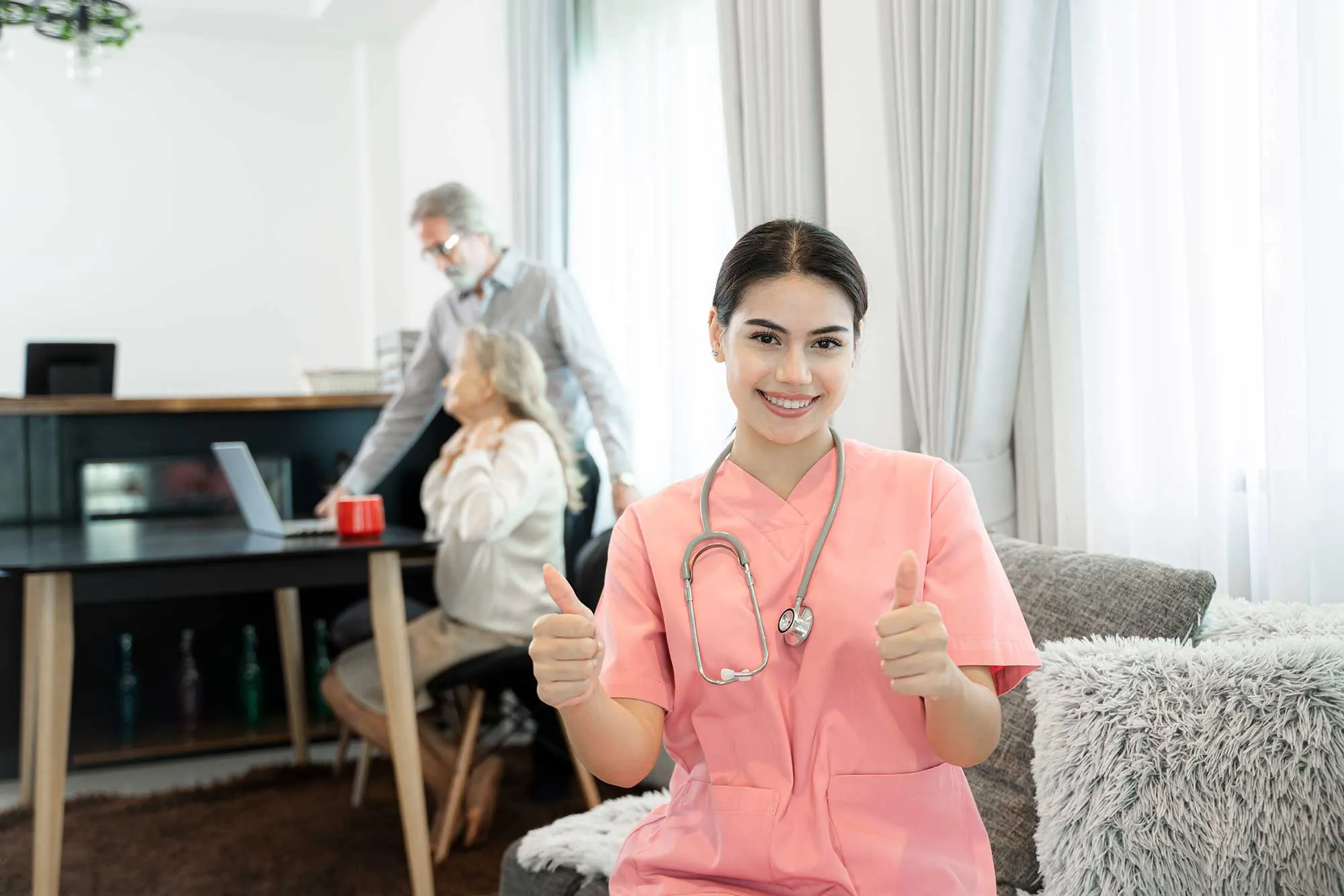 Caregiver chatting with elderly client